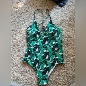 Palm print one piece bathing suit.  Never worn